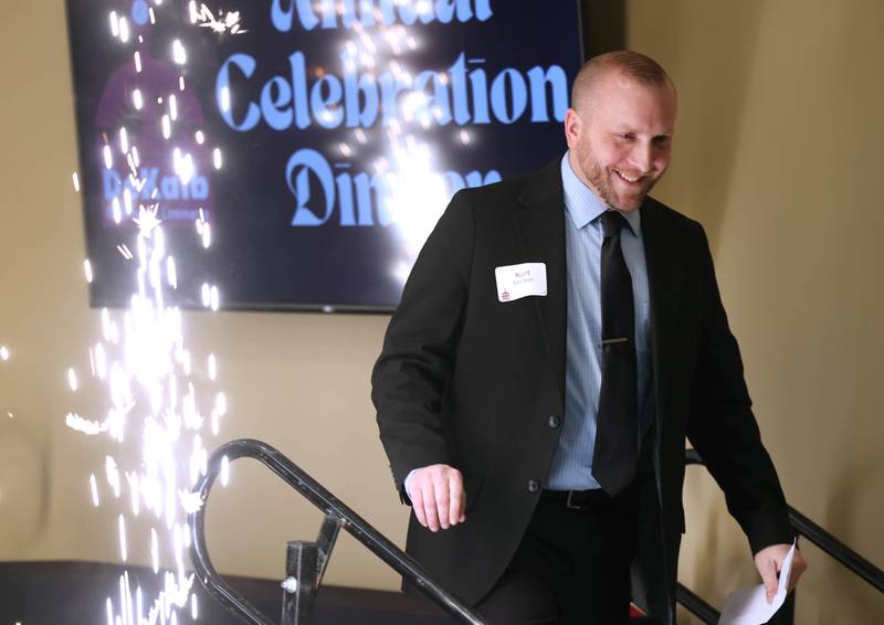 Kurt Mattson, from DeKalb Mechanical, walks past the sparklers to accept the Business of the Year Award on behalf of DeKalb Mechanical Thursday, Feb. 5, 2026, during the DeKalb Chamber of Commerce Annual Celebration Dinner at Faranda's Banquet & Conference Center.