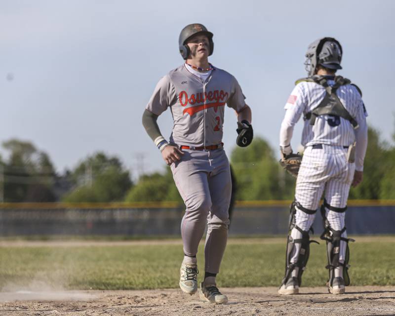 Oswego's Easton Ruby (2) scores a run during baseball game between Oswego East at Oswego. Monday, May 19, 2025 in Oswego.