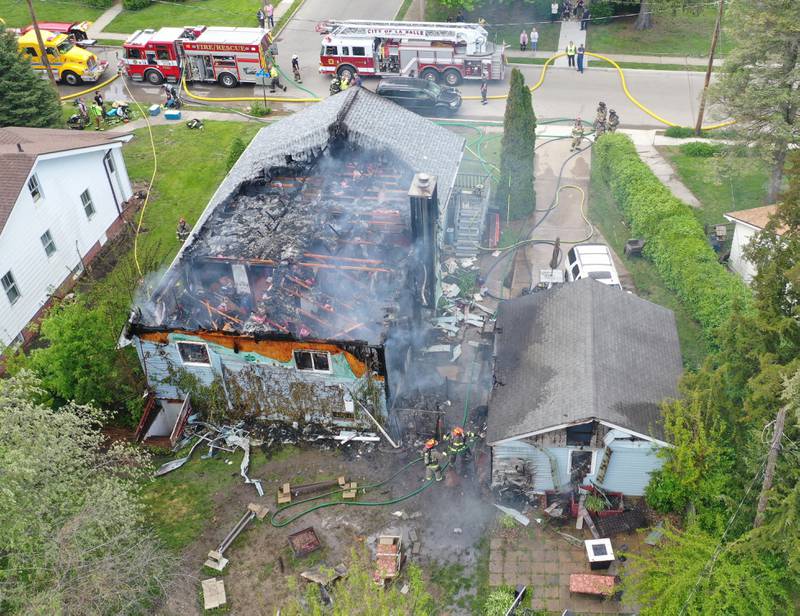 Firefighters work the scene of a structure fire in the 1900 block of Main Street on Monday, May 4, 2026 in Peru.