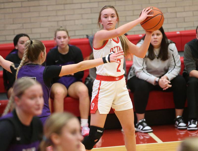 Ottawa's Ashlynn Ganiere looks to pass as Dixon's Morgan Hargrave defends on Wednesday, Nov. 29, 2023 at Kingman Gym.