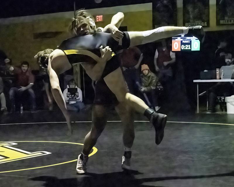 Erie-Prophetstown's Jase Grunder (back) picks up Riverdale's Eli Hinde during the 152-pound title bout at the 1A Riverdale Regional on Saturday, Feb. 4, 2023.