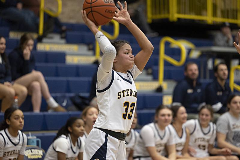 Sterling’s Joslynn James looks to pass against Geneseo Thursday, Dec. 7, 2023 at Sterling High School.