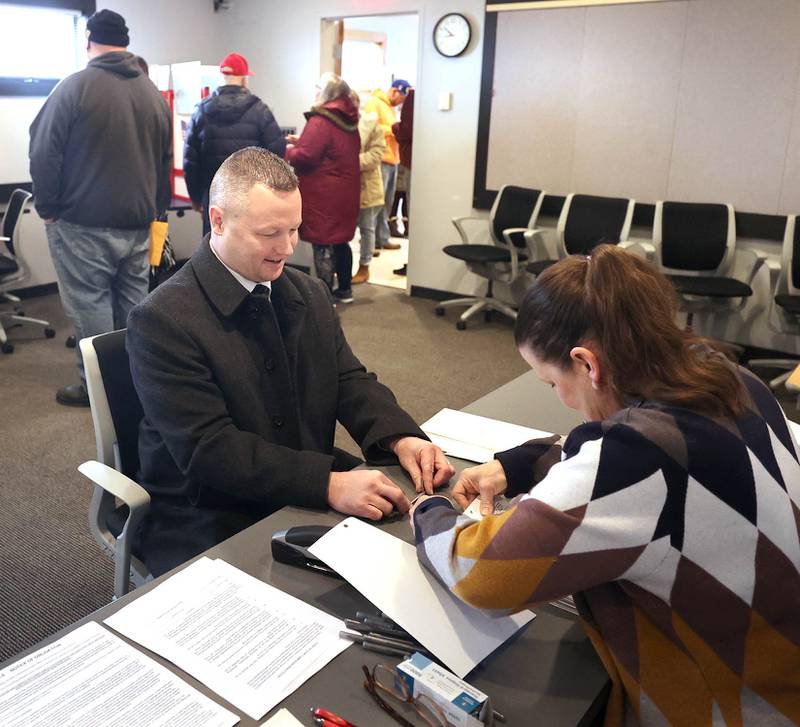 DeKalb County Sheriff Andy Sullivan files his petitions for re-election as a line of other candidates for various offices wait their turn Monday, March 7, 2022, in the DeKalb County Administration Building in Sycamore. Monday was the first day candidates could file to be on the ballot for the November 2022 election.