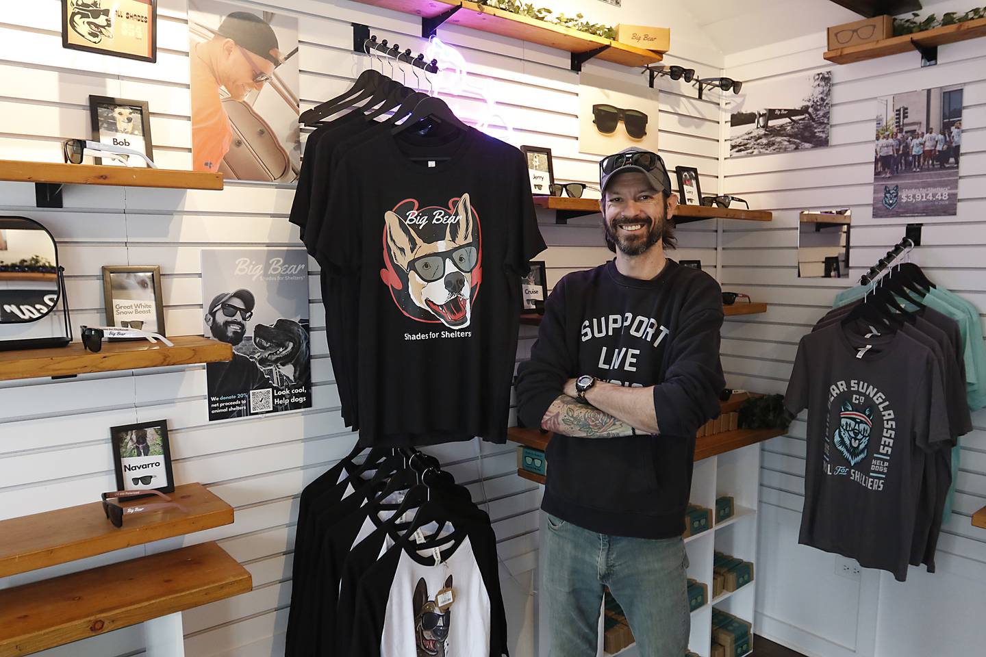 Rick Stiles, the owner of Big Bear Sunglasses, inside his tiny shop on Friday, April 25, 2025, at the McHenry Riverwalk Shoppes. The shops open for the 2025 season on May 2.