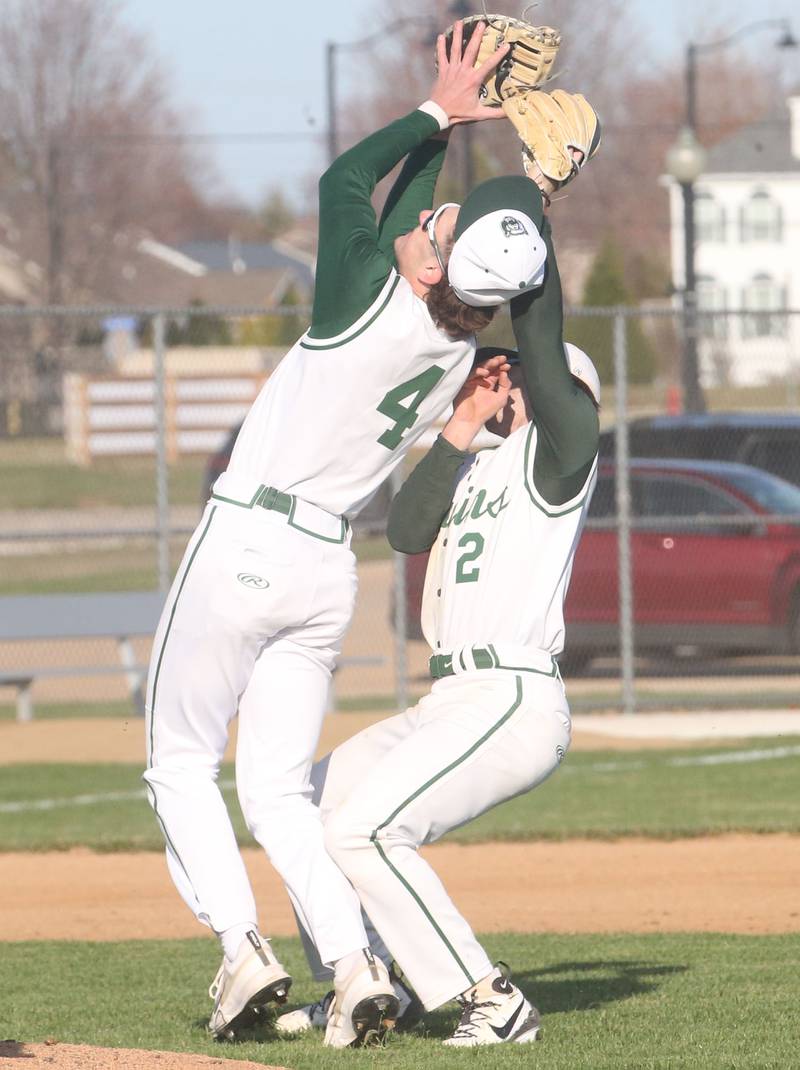St. Bede's Gini Ferrari catches an infield fly ball as teammate Gus Burr backs off from the play on Monday, March 31, 2025 at Schweickert Stadium in Peru.