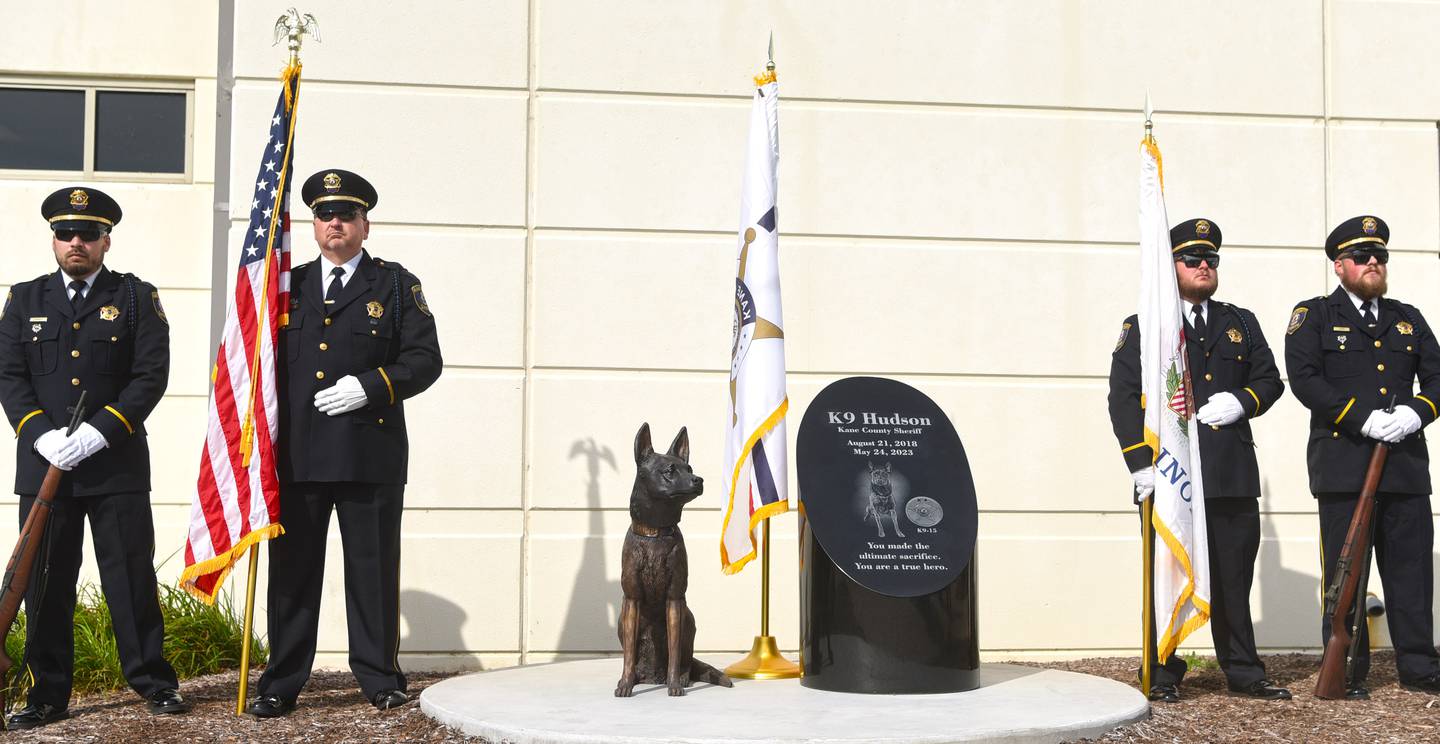 The Kane County Sheriff's Department Honor Guard stands at attention during a moment of silence Friday at the  dedication of a monument to Hudson, the office's police dog killed in the line of duty last year.