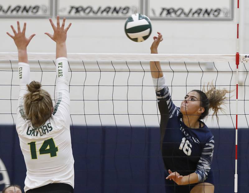 Cary-Grove’s Gabby Lopez, right tries to hit the ball past the block Crystal Lake South’s Emma Stowasser, left, during a Fox Valley Conference volleyball match Thursday, Aug. 25, 2022, between Cary-Grove and Crystal Lake South at Cary-Grove High School.