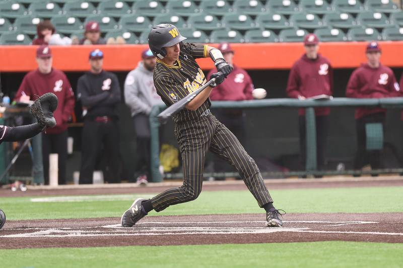 Joliet West’s Bobby Malinowski connects for a walk-off single against Lockport in the WJOL Don Ladas Memorial baseball tournament championship game on Saturday, April 4, 2026 in Joliet.