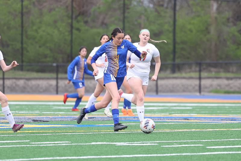 Joliet Central’s Victoria Davila works the ball midfield against Plainfield East on Thursday, April 11, 2024.