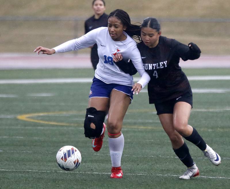 Larkin’s Amethyst Elliot battles with Huntley’s Kaycee Claudio for control of the ball during a nonconference soccer match on Thursday, March 26, 2026, at Huntley High School.