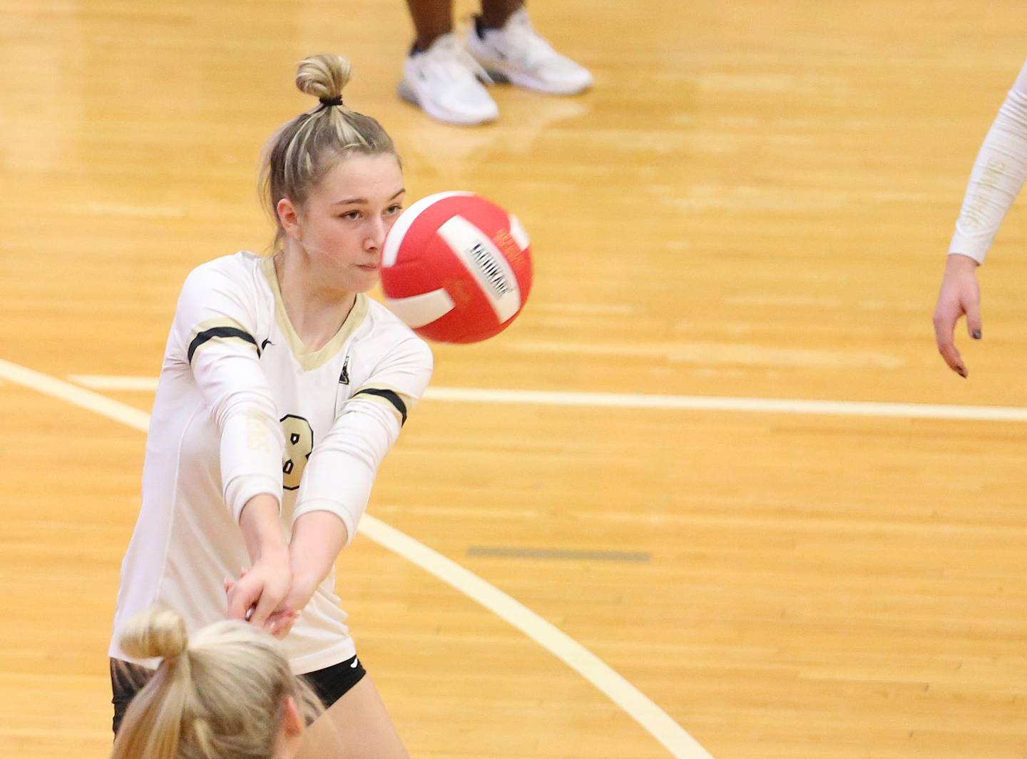 Sycamore's Ava Carpenter returns a serve from Ottawa on Thursday, Oct. 12, 2023 at Kingman Gym.
