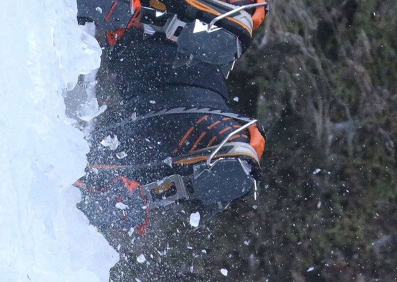 Climbers use special footware called crampons when scaling the waterfalls on Friday, Jan. 24, 2025, in Wildcat Canyon at Starved Rock State Park. The specialized cleats dig into the frozen waterfall and help support their footing.