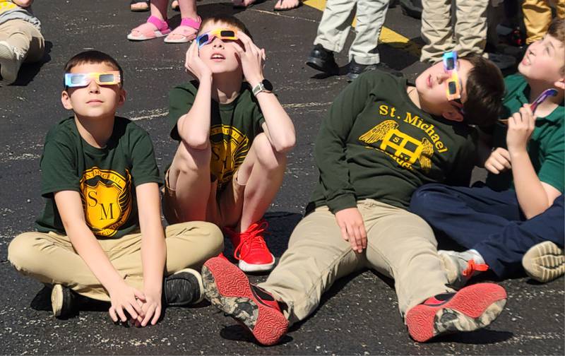 Through special glasses that arrived at the school just hours before, students from St. Michael the Archangel Catholic School in Streator each took a different angle in their view of Monday's solar eclipse..