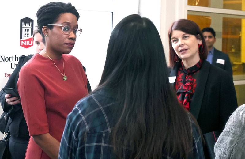 U.S. Rep. Lauren Underwood, D-Naperville, (left) and Northern Illinois University President Lisa Freeman talk to students after Underwood toured the semi-conductor lab Friday, Jan. 20, 2023, at the NIU College of Engineering and Engineering Technology building in DeKalb. Underwood was visiting NIU to celebrate the university receiving $1.5 million in federal funding to upgrade its microchips manufacturing lab.