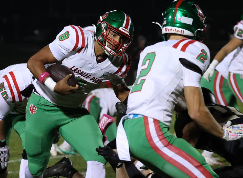 La Salle-Peru's Marion Persich gets outside of the Sycamore defense to pick up yardage during their game Friday, Oct. 10, 2025, at Sycamore High School.