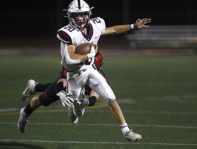Prairie Ridge's Jesse Kautz tries to break the tackle attempt of Huntley's Noah Van de Voorde during a Fox Valley Conference football game against on Friday, Sept. 20, 2024, at Huntley High School.
