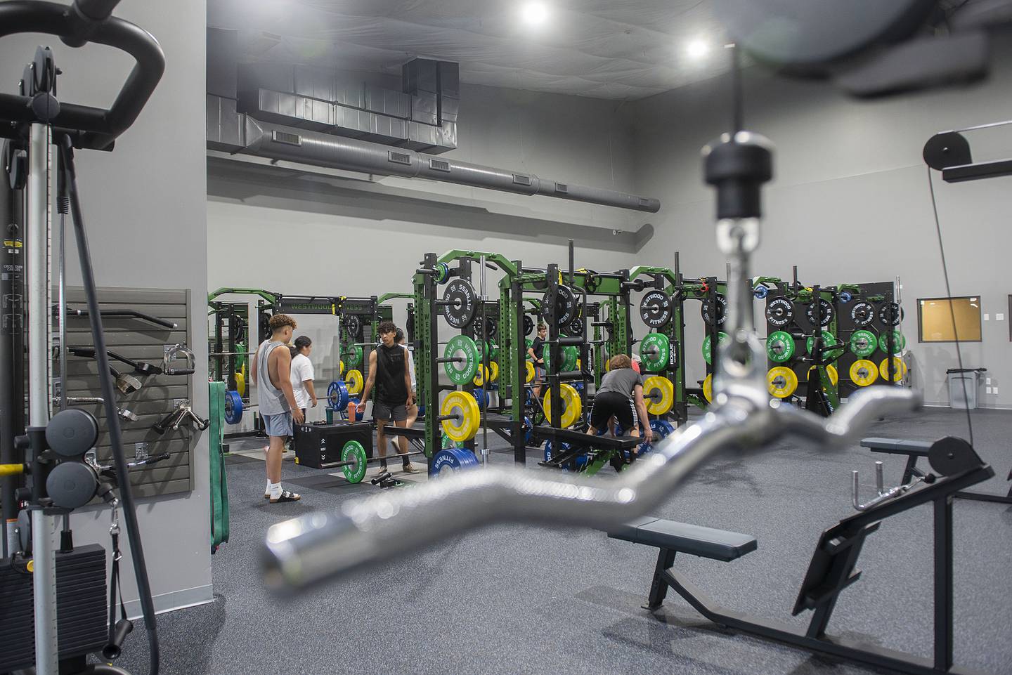 People workout in a recently completed free weight area at Westwood Wednesday, June 8, 2022.
