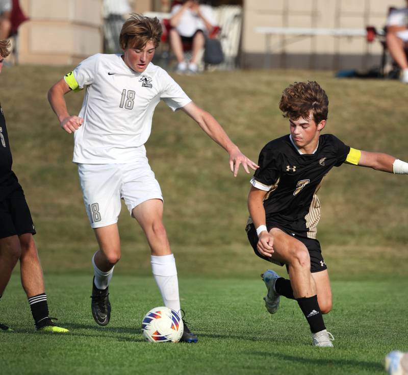 Kaneland's Matthew Mitchinson tries to hold off Sycamore's Henry Bumpus during their game Wednesday, Sept. 18, 2024, at Sycamore High School.