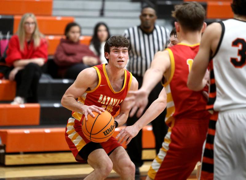 Batavia's Joe Reid looks for an opening during a game against Wheaton Warrenville South on Friday, Feb. 14, 2025 in Wheaton.
