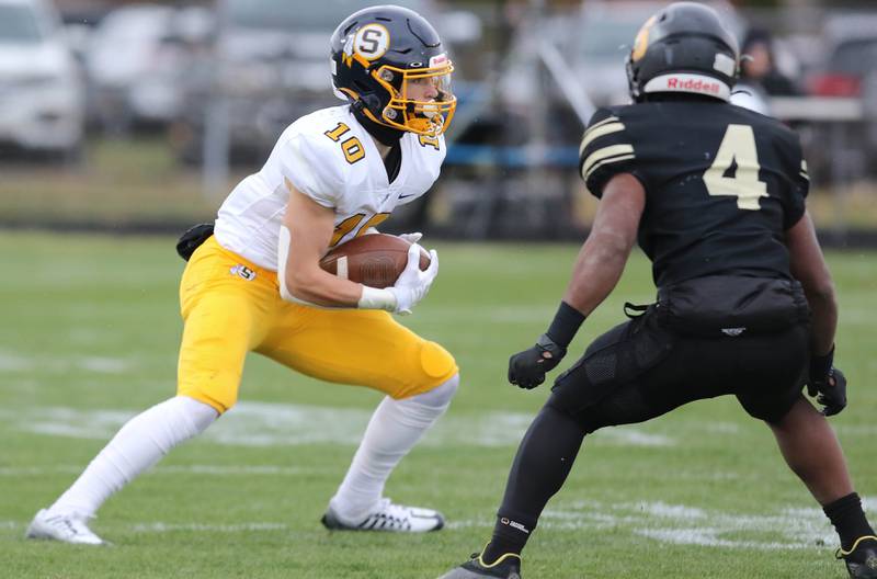 Sterling's Cale Ledergerber looks to get by Sycamore's Tyler Curtis during their Class 5A state playoff game Saturday, Nov. 12, 2022, at Sycamore High School.