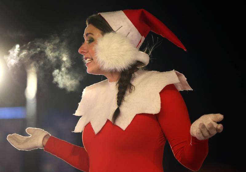 You can see the chill in the air as Elfie addresses the crowd in front of the Egyptian Theatre Thursday, Dec. 4, 2025, during the annual Lights on Lincoln and Santa Comes to Town event hosted by the DeKalb Chamber of Commerce.