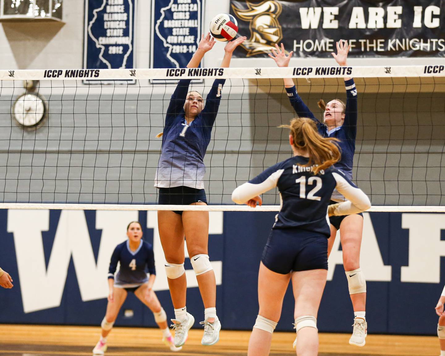 Nazareth's Olivia Austin (7) leaps high for the block during volleyball match between Nazareth at IC Catholic Prep.  Aug 29, 2023.
