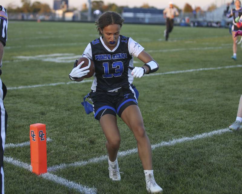 St. Charles North's Alexzandria Richardson (13) scores a touchdown during Oswego East Regional Final flag football game between St. Charles North at Oswego East Thursday, Oct 9, 2025 in Oswego.