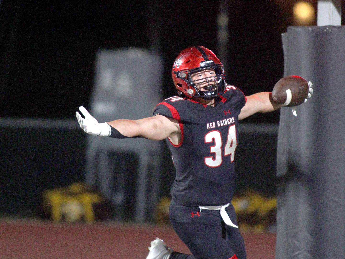 Huntley’s Haiden Janke cruises through the end zone with a touchdown against Jacobs in varsity football in Huntley Friday night.