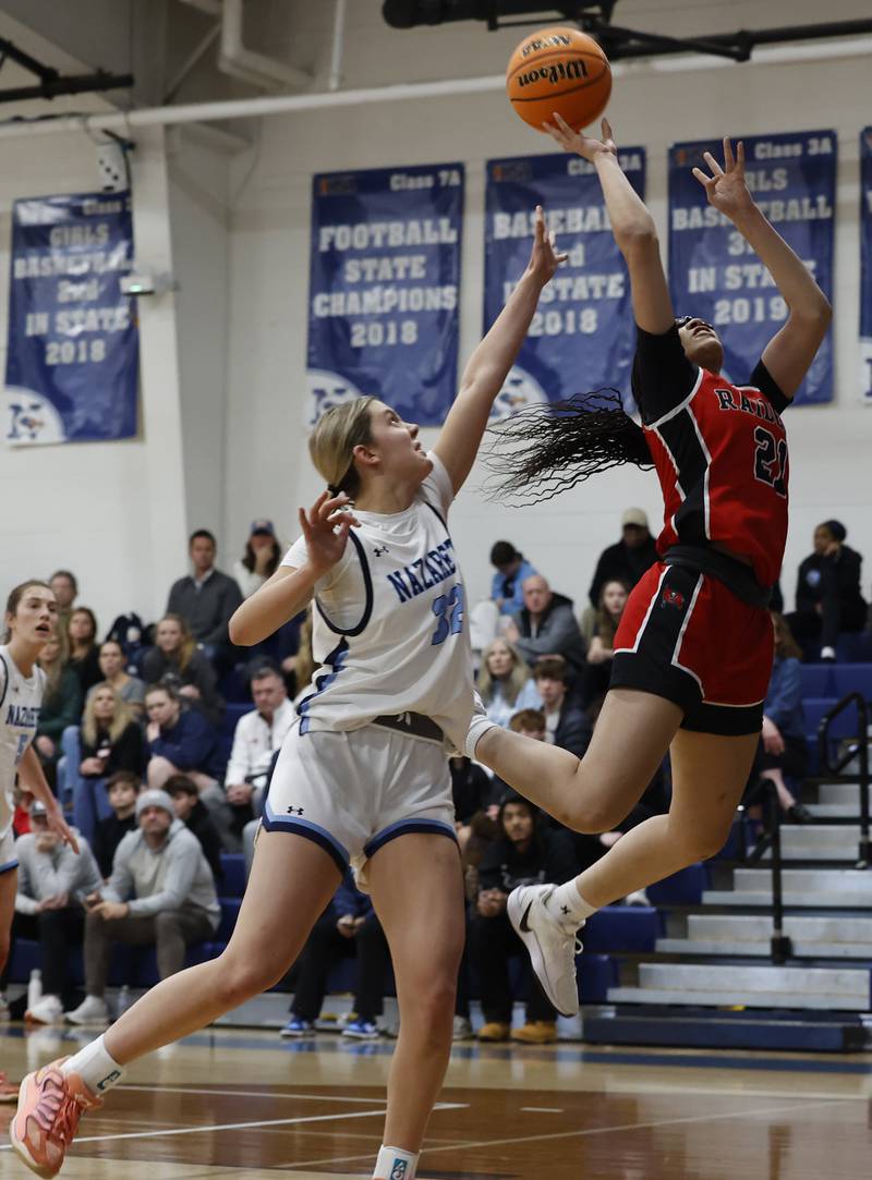 Bolingbrook's Skylar Wakefield (21) puts up a shot during the girls varsity basketball game between Bolingbrook high school and Nazareth Academy on Monday, Jan. 12, 2026 in La Grange Park.