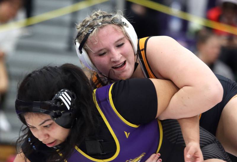 McHenry’s Madalynn Sima, right, battles Rolling Meadows’ Leilani Brindis at 170 pounds in varsity girls IHSA Regional Championship wrestling action on Saturday, February 7, 2026, at Hampshire High School in Hampshire.