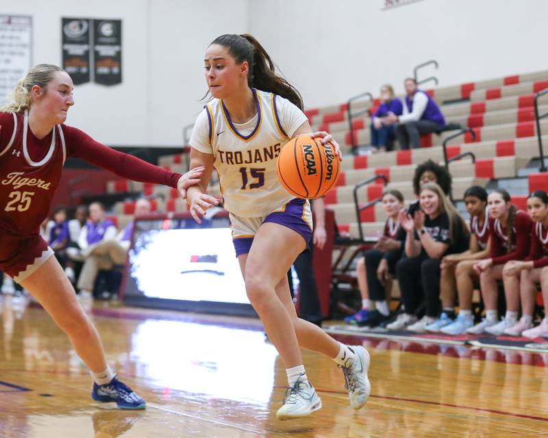 Downers Grove North's Adysen Fanta (15) drives baseline during their Regional Final basketball game between Downers Grove North at Plainfield North. Feb 20, 2025 in Plainfield.