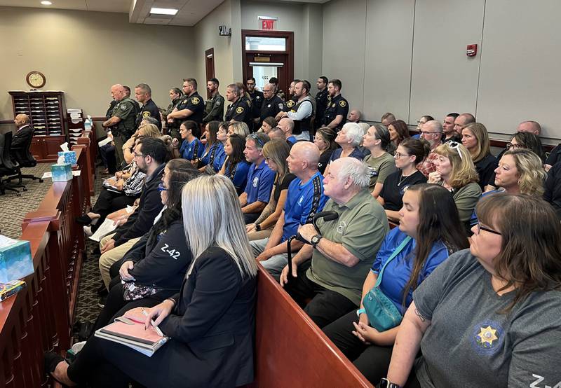 Dozens of law enforcment members along with family and friends of Christina Musil pack the courtroom Tuesday, Aug. 26, 2025, during the sentencing hearing for Nathan P. Sweeney, who pleaded guilty to driving under the influence and causing the 2024 crash that killed Musil. Sweeney was sentenced to the maximum of 14 years.