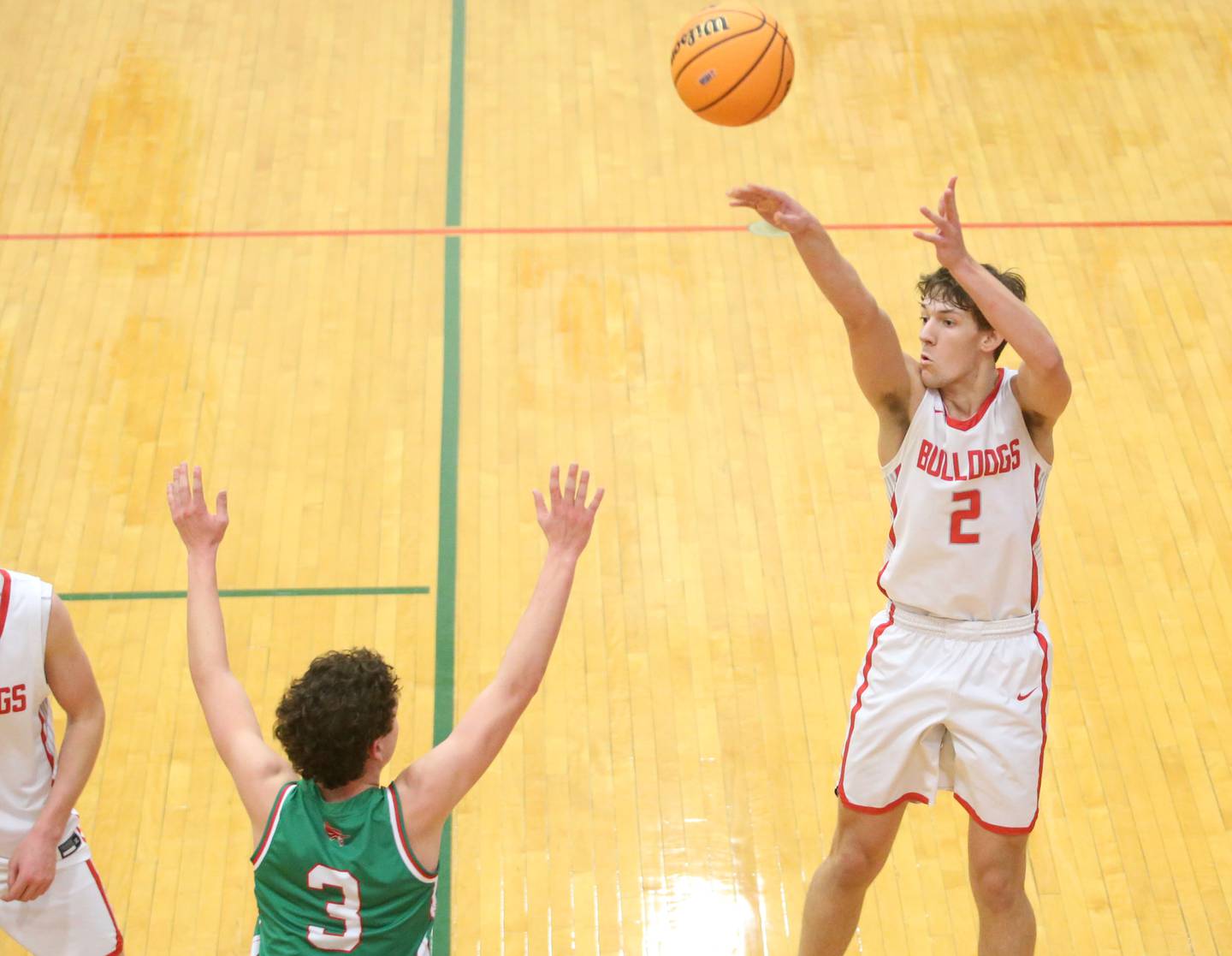 Streator's Matt Williamson (2) sinks a jump shot over L-P's Mikey Hartman (3) during the Class 3A La Salle-Peru Regional title game this past season in Sellett Gymnasium.