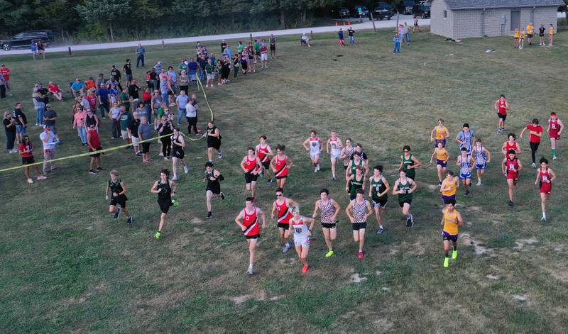 Boys cross country teams leave the starting line during the Ottawa Nautical Mile Relay on Tuesday, Sept. 2, 2025 at Catlin Park in Ottawa.