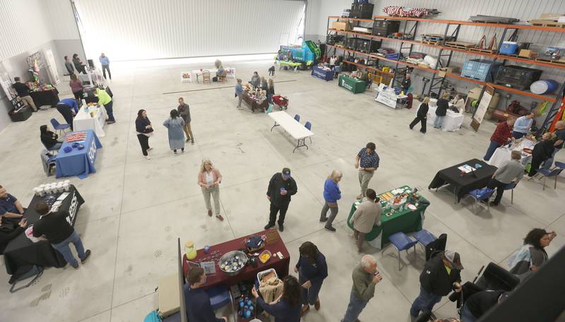 An overhead view inside an airplane hangar of the Illinois Valley Chamber of Commerce annual block party on Wednesday, April 29, 2029 at the Illinois Valley Regional Airport in Peru.