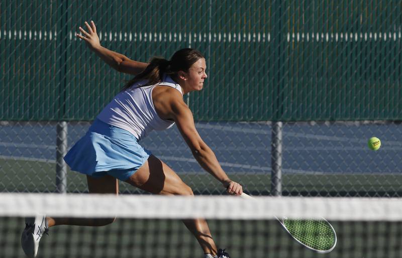Marian Central’s Kaitlyn Remke returns the ball during the first day of the IHSA State Girls Tennis Tournament in October at Hersey High School in Arlington Heights.