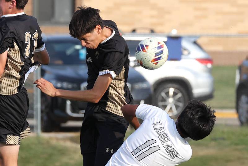 Sycamore's Javier Lopez heads the ball over Kaneland's Abe Paulino during their game Wednesday, Sept. 18, 2024, at Sycamore High School.
