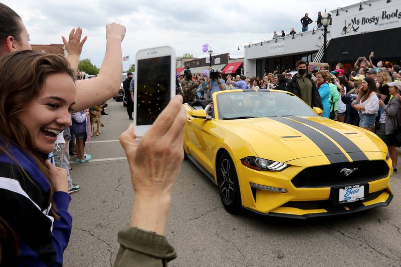 Grace Kinstler, a Crystal Lake Central High School graduate and finalist on "American Idol," arrives by procession through downtown on Tuesday, May 18, 2021, in Crystal Lake.