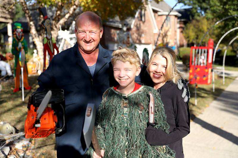 Mark Licht (left), son Noah, 10, (center) and wife, Laura (right), are in their sixth year of competing in the St. Charles Park District Halloween decorating competition at their home, which is located in the Thornwood subdivision in South Elgin.