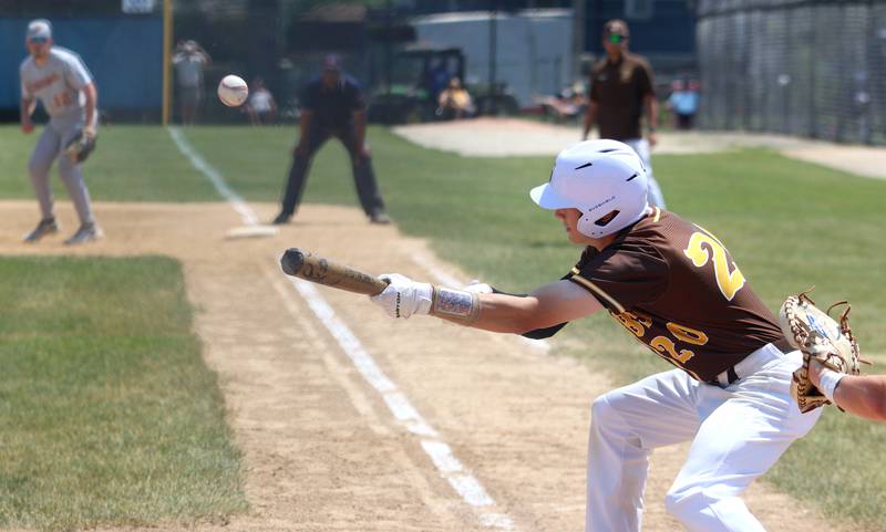 Jacobs’ Nathan Gerritsen bunts against Hononegah in Class 4A Sectional baseball action at Carpentersville Saturday.