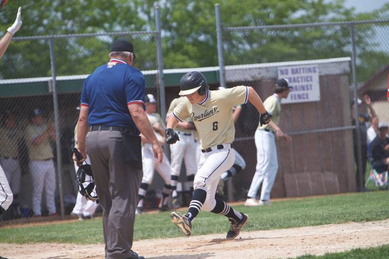 Sycamore's Owen Piazza scores a run against against Belvidere North at the Class 4A Regional Final on May 28, 2022 in Belvidere.