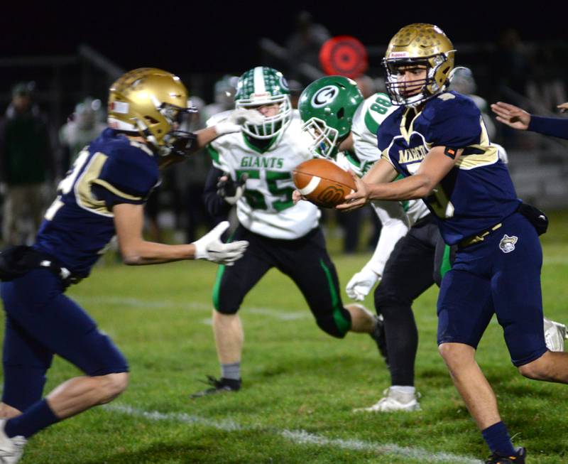Polo's Gus Mumford (5) hands the ball off to Billy Lowry (12) during 8-man playoff action against Alden-Hebron on Friday, Nov. 1, 2024 in Polo.