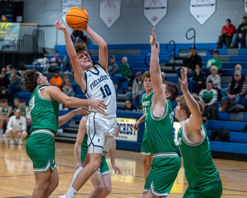 Kash Klendworth (10) of Fieldcrest looks to pass ball to teammate on Monday, December 15, 2025 at Fieldcrest High School in Minonk.