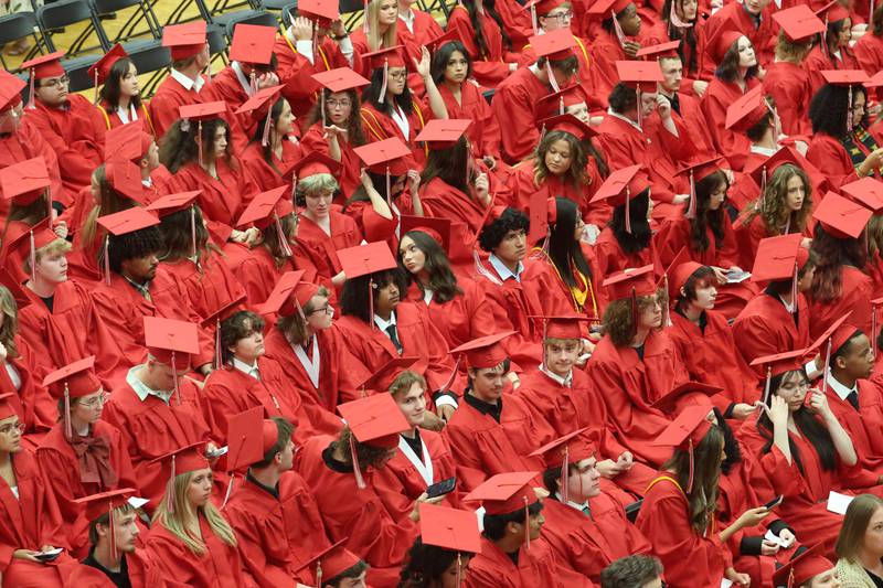 Ottawa High School class of 2026 graduates take their seats during the commencement ceremony in Kingman Gymnasium on Friday, May 22, 2026 at Ottawa High School