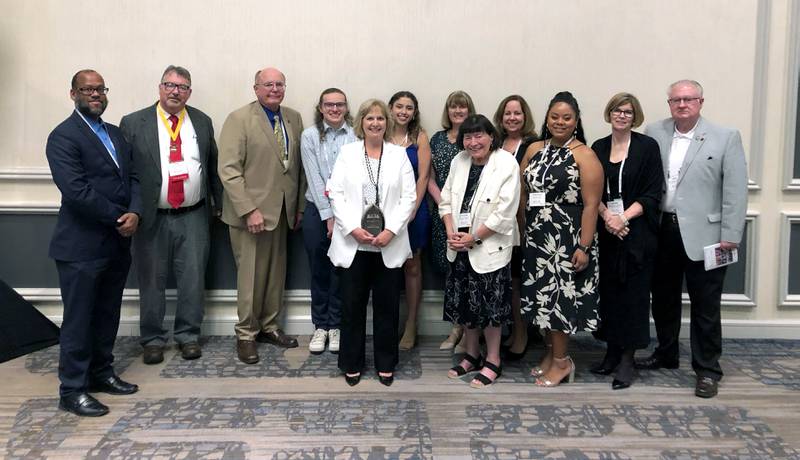 Pictured: Kishwaukee College Board members, leadership, faculty and staff being presented with the 2022 Equity and Diversity Award at the annual ICCTA banquet