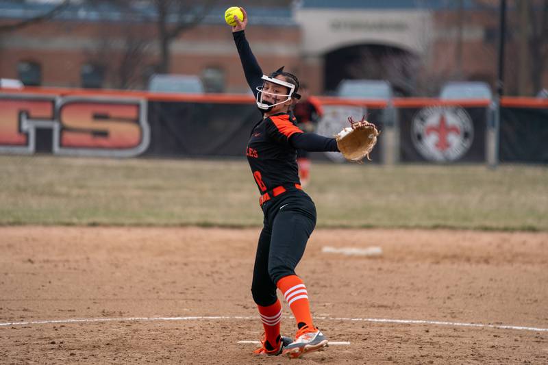St.Charles East's Grace Hautzinger (8) delivers a pitch against Yorkville during a softball game at St.Charles East High School on Wednesday, Mar 22, 2023.