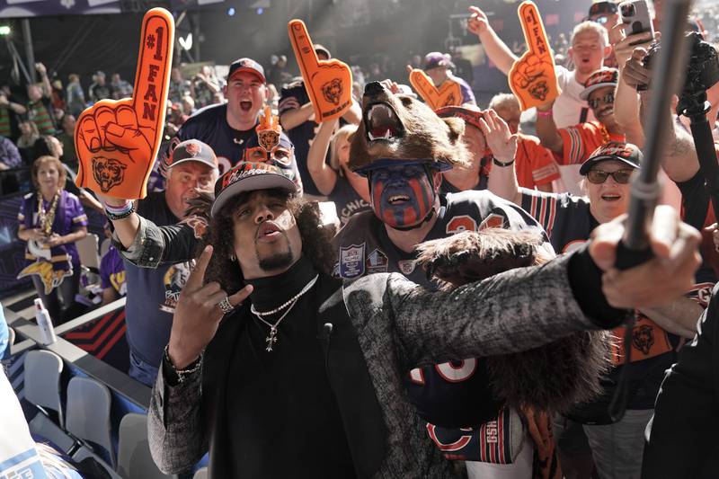 Cornerback Kyler Gordon takes selfies with fans after being selected by the Chicago Bears during the second round of the NFL draft Friday, April 29, 2022, in Las Vegas.