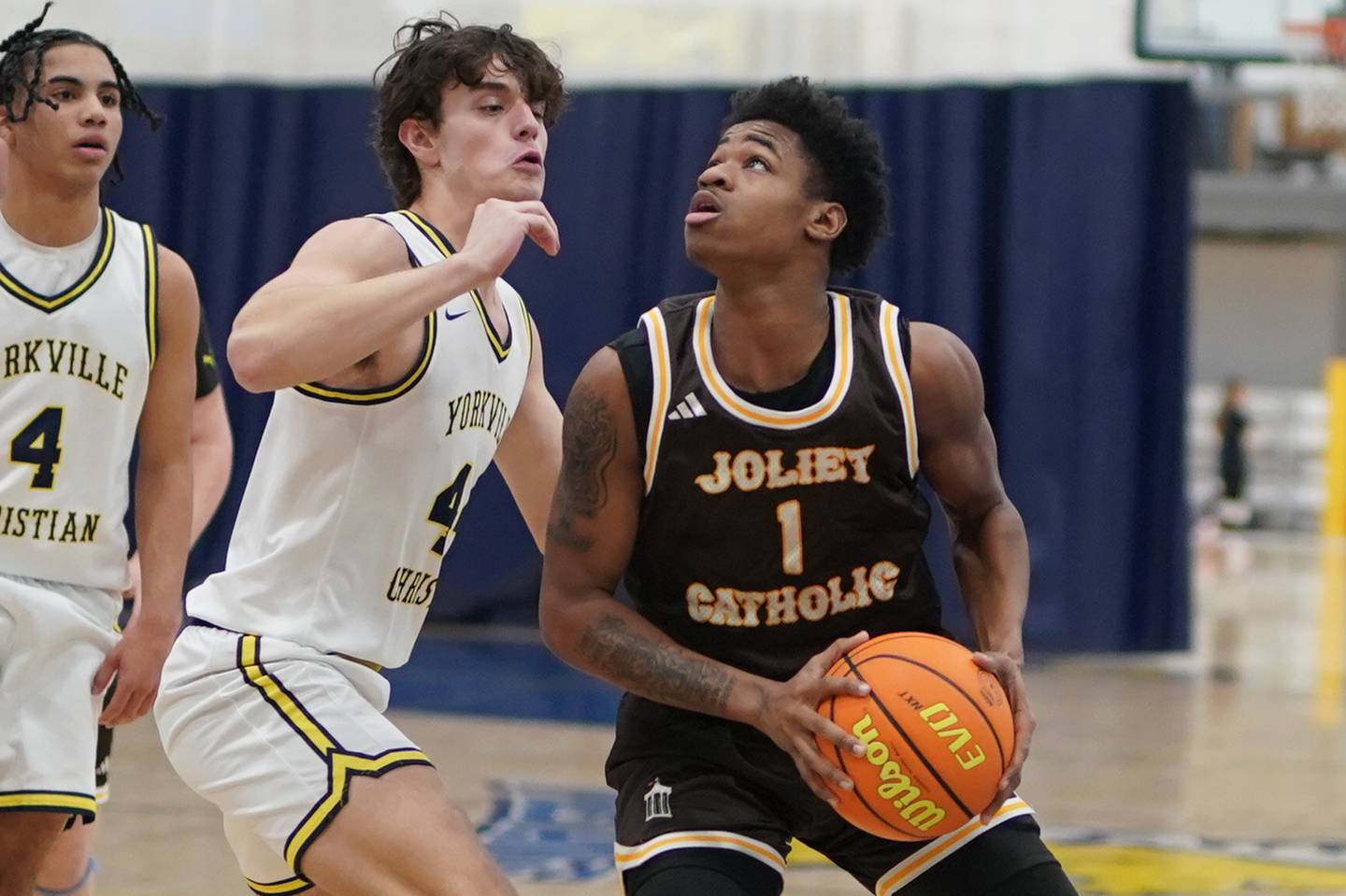 Joliet Catholic's Jayden Armstrong (1) plays the ball in the post against Yorkville Christian's Jack Versluys (44) during a basketball game at Yorkville Christian High School on Monday, January 13, 2017.