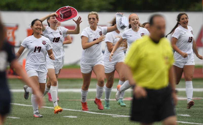 Lincoln-Way Central players celebrate their win against  Evanston in the Class 3A IHSA state girls soccer third-place game in Naperville on Saturday, June 4, 2022.