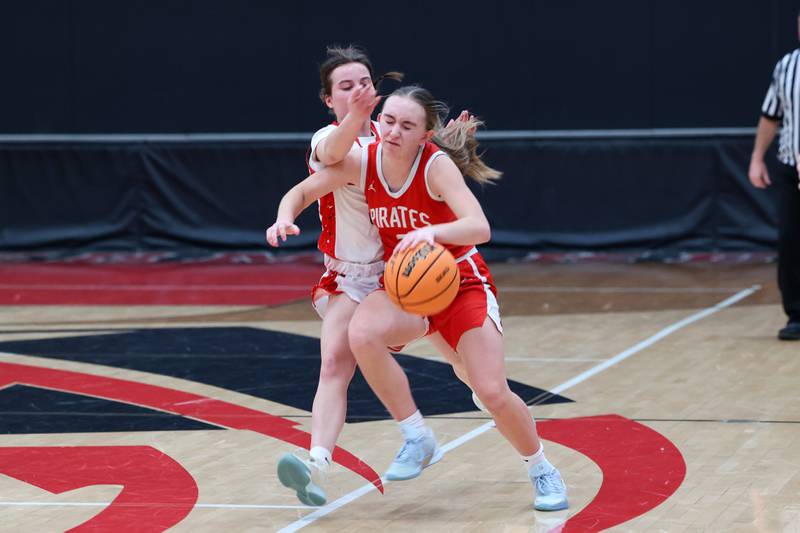 Ottawa's Ashlynn Ganiere is fouled by Bradley-Bourbonnais' Katie McBurnie late in the fourth quarter during Ottawa's 55-44 victory on Monday, Feb. 9, 2026.